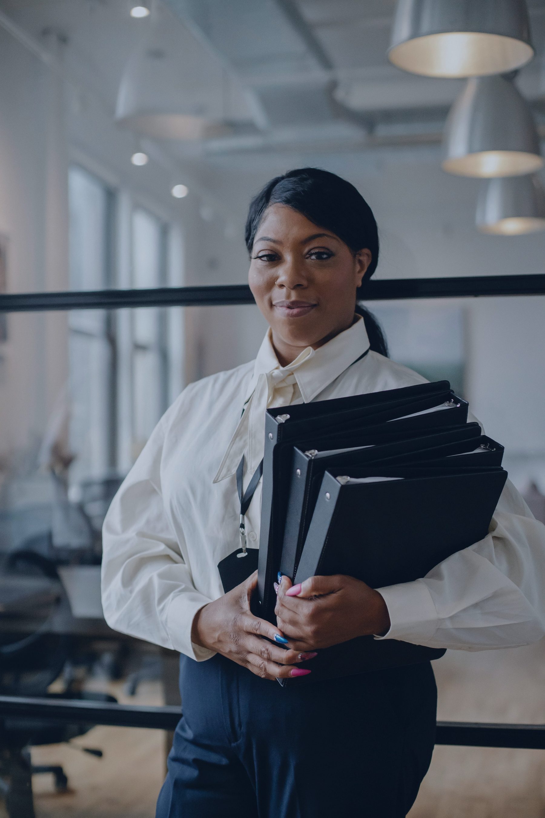 Solicitor carrying case files at the Abinelle Solicitors office
