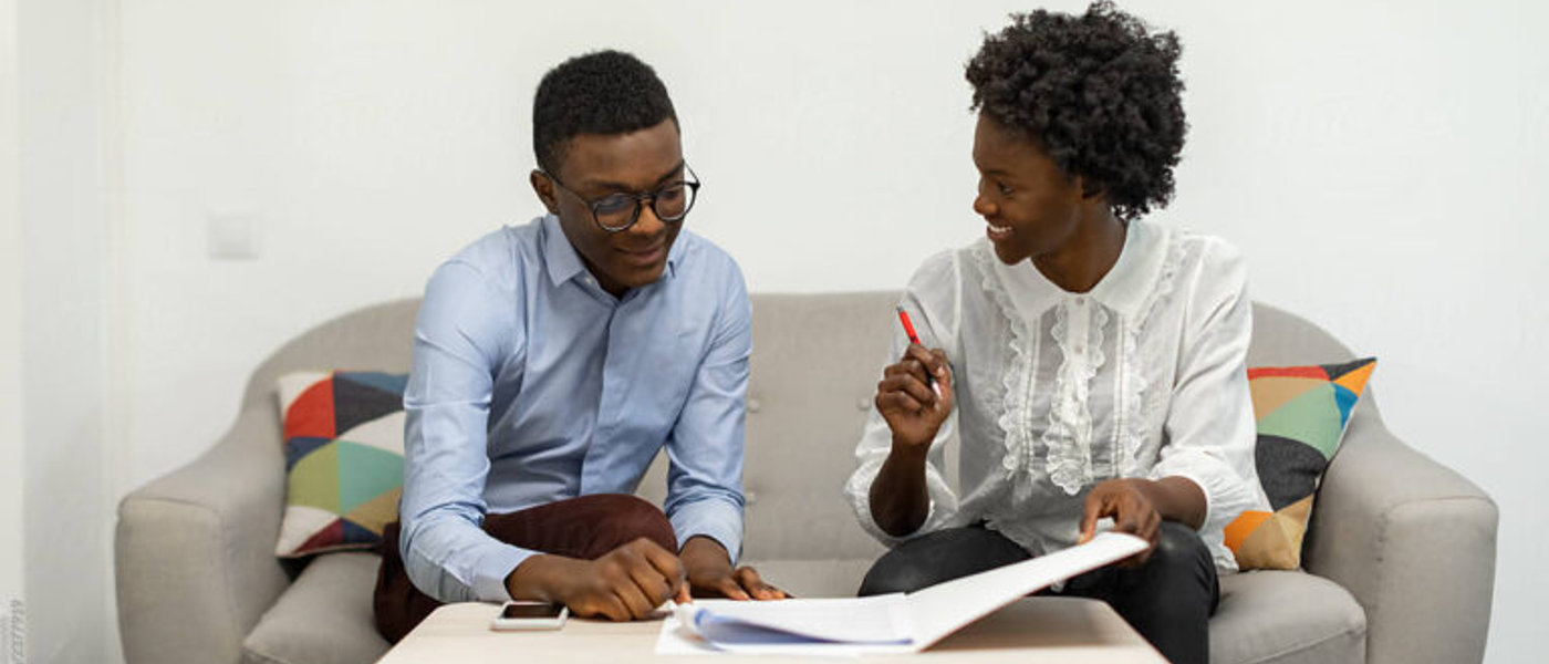 Two clients reviewing legal documents together